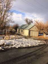 View of home's exterior featuring an outbuilding