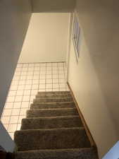 Staircase with tile patterned flooring