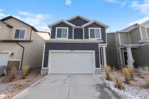 View of front of home with a garage