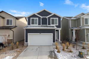 View of front of property featuring a garage