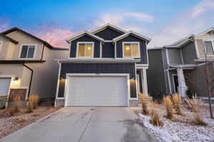 View of front facade featuring a garage