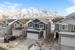 View of front facade featuring a mountain view and a garage