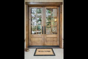 Doorway to property featuring french doors