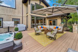 Deck featuring an outdoor hangout area and area for grilling