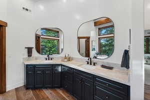 Bathroom featuring hardwood / wood-style floors and vanity