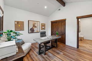 Office area with beamed ceiling, high vaulted ceiling, and hardwood / wood-style flooring