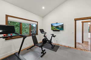 Workout area with vaulted ceiling