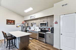 Large island. Beautiful Quartz Countertops, and much-needed anti-slam Cabinets