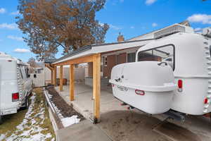 View of side of home featuring a carport