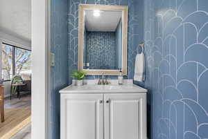 Bathroom featuring vanity and hardwood / wood-style flooring