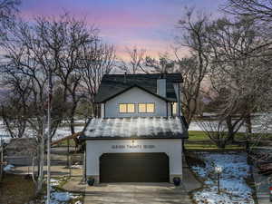 View of front of property featuring a garage