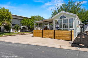 View of front of property featuring a carport