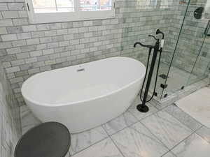 Freestanding tub w/floor mount faucet and custom tile