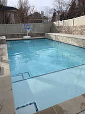 New Custom 18x26 Salt Water Pool with water falls, swim out shallow end for lounging and kids area.