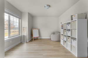 Living area featuring light hardwood / wood-style floors