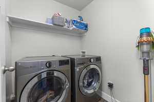 Washroom with washing machine and dryer