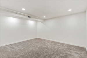 Empty room with carpet floors