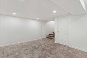 Basement featuring carpet flooring