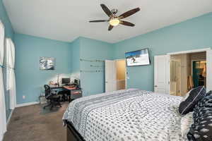 Carpeted bedroom with ceiling fan