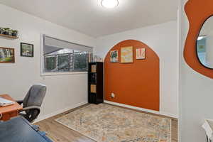 Office area with wood-type flooring