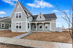 View of front of home featuring covered porch