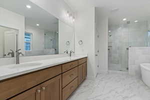 Bathroom with vanity and independent shower and bath