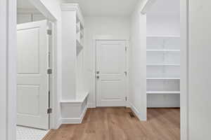 Mudroom with light wood-type flooring