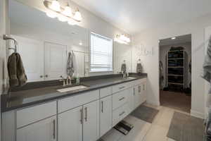 Bathroom featuring vanity and tile patterned floors