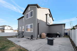 Rear view of property featuring a patio