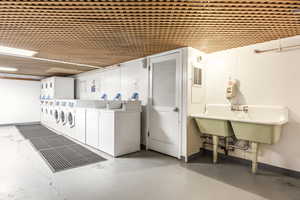 Laundry area with washer and clothes dryer and stacked washer and clothes dryer