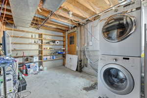 Basement with stacked washer and dryer