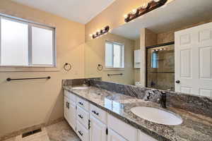 Bathroom featuring tile patterned floors, tub/shower, a textured ceiling, vanity, and toilet