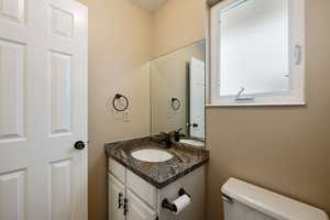 Bathroom with vanity and toilet