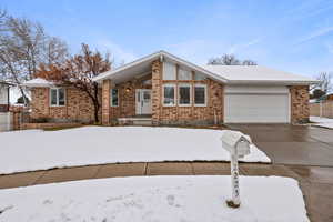 Single story home featuring a garage