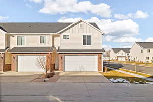 Townhome / multi-family property featuring a garage