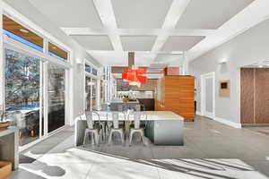 Interior space featuring tile patterned floors and coffered ceiling