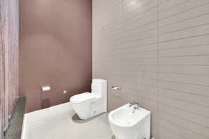 Bathroom with a bidet and toilet