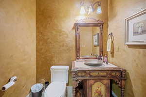 Bathroom featuring vanity and toilet