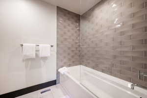 Bathroom featuring tiled shower / bath