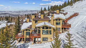 Snowy aerial view featuring a mountain view