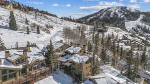 Snowy aerial view with a mountain view