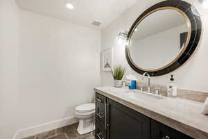 Bathroom with vanity and toilet