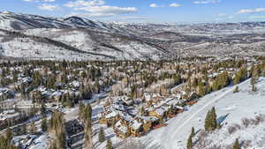 Snowy aerial view with a mountain view