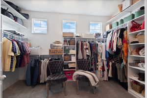 Walk in closet featuring carpet flooring