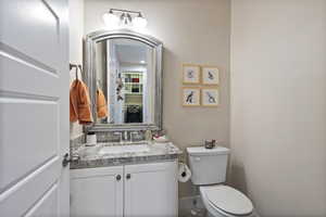 Bathroom featuring vanity and toilet