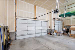 Garage featuring a garage door opener