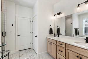 Bathroom with vanity and an enclosed shower