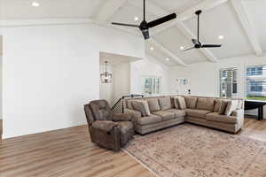 Living room featuring a wealth of natural light, ceiling fan, and light hardwood / wood-style flooring