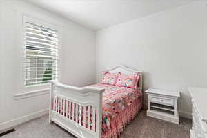 View of carpeted bedroom