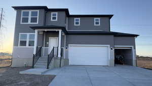 View of front property with a garage